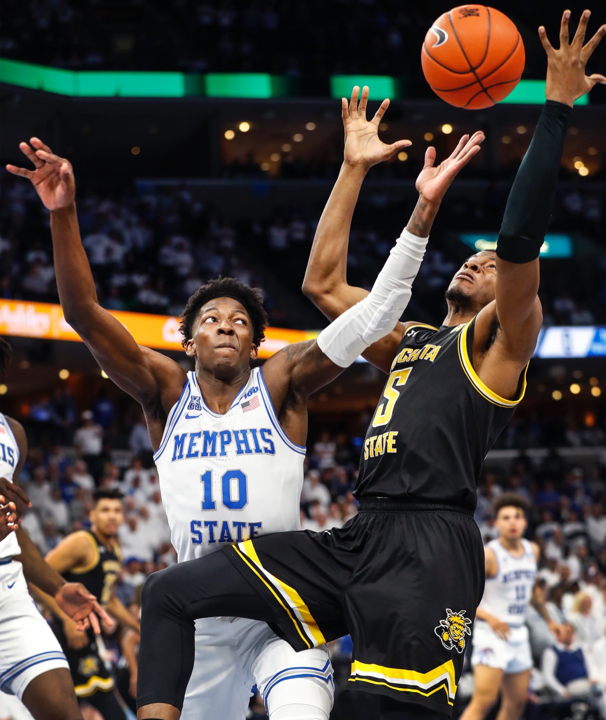 <strong>Memphis guard Damion Baugh (left) battles Wichita State guard Trey Wade (right) for a loose ball March 5, 2020, at FedExForum.</strong> (Mark Weber/Daily Memphian)