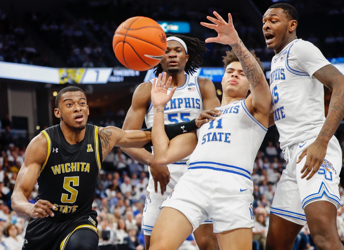 <strong>Wichita State guard Trey Wade (left) is called for a foul after pushing Memphis defender Lester Quinones (middle right) March 5, 2020 at the FedExForum.</strong> (Mark Weber/Daily Memphian)