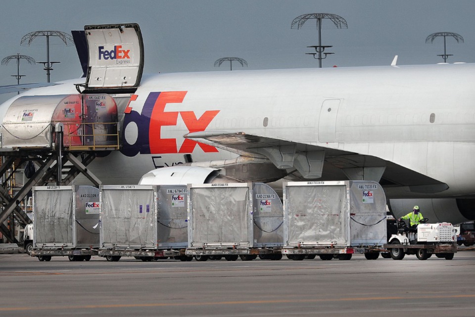 <strong>FedEx workers move packages at the hub in this September 2019 file photo. FedEx employees who have less than five years of service with the company will be getting an extra week of paid vacation.</strong> (Jim Weber/Daily Memphian file)