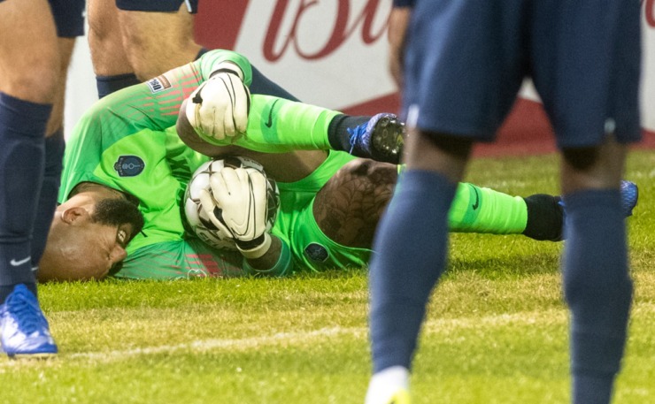 <strong>Memphis 901 FC goalie Tim Howard grimaces in pain after being kicked when stopping a goal against Indy Eleven during the season opener at AutoZone Park Saturday, March 7, 2020.</strong> (Greg Campbell/Special to The Daily Memphian)