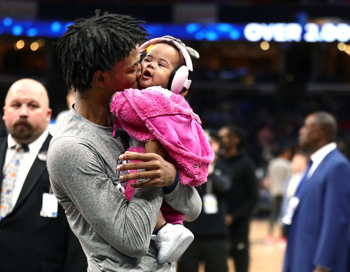 <strong>Memphis Grizzlies guard Ja Morant (12) kisses his daughter before a March 7, 2020, game at FedExForum against the Atlanta Hawks.</strong> (Patrick Lantrip/Daily Memphian)