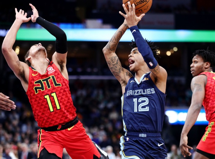 <strong>Memphis Grizzlies guard Ja Morant (12) drives to the basket against Atlanta Hawks guard Trae Young (11) during a March 7, 2020, game at FedExForum against the Atlanta Hawks.</strong> (Patrick Lantrip/Daily Memphian)