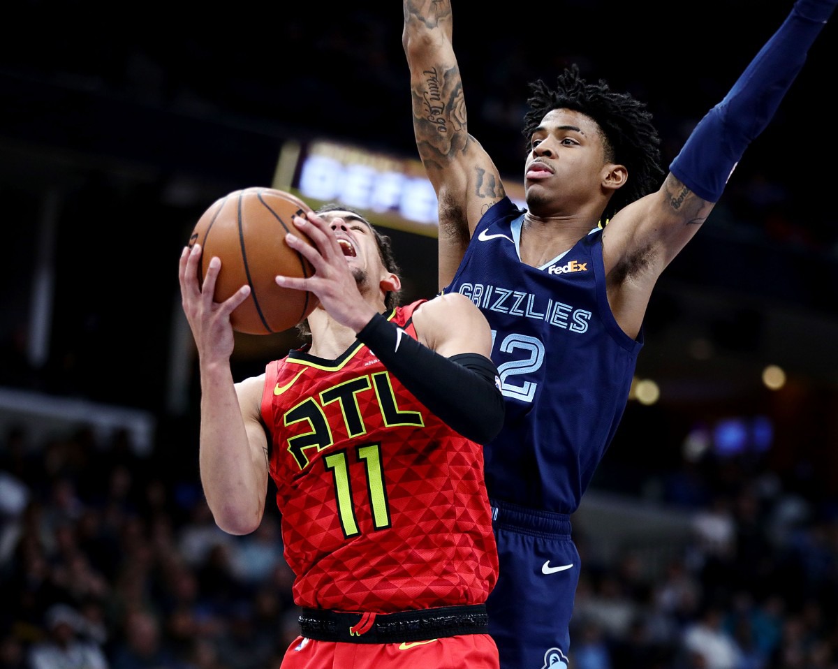 <strong>Memphis Grizzlies guard Ja Morant (12) plays tight defense on Atlanta Hawks guard Trae Young (11) during a March 7, 2020, game at FedExForum against the Atlanta Hawks.</strong> (Patrick Lantrip/Daily Memphian)