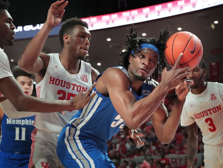 <strong>University of Memphis forward Precious Achiuwa tries to control a rebound under pressure by Houston's Fabian White (35) during the Tigers' game against the Cougars at the Fertitta Center in Houston on March 8, 2020.</strong> (Jim Weber/Daily Memphian)