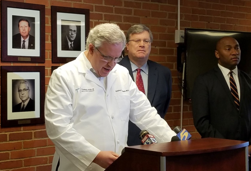 <strong>Accompanied by Memphis Mayor Jim Strickland (center) and Shelby County Mayor Lee Harris (right), Dr. Stephen Threlkeld addresses the confirmed case of coronavirus in Shelby County during a press conference Sunday, March 8.</strong> (Shelby County Health Department)