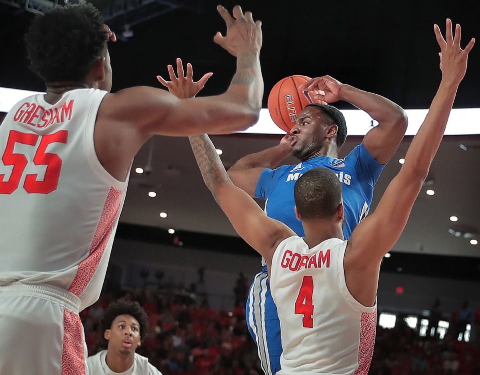 <strong>University of Memphis guard Alex Lomax looks for an open man under pressure by Houston's Justin Gorham (4) during the Tigers' game against the Cougars at the Fertitta Center in Houston on March 8, 2020.</strong> (Jim Weber/Daily Memphian)