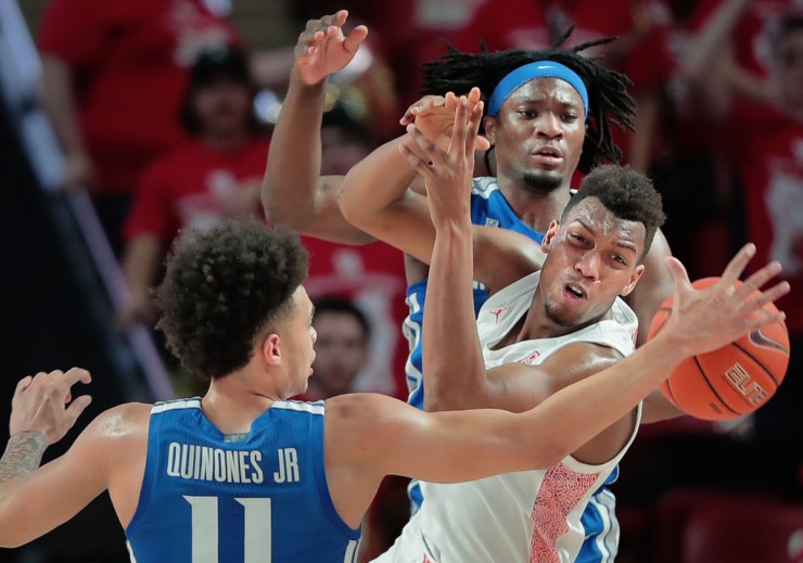 <strong>University of Memphis guard Lester Quinones (11) and forward Precious Achiuwa battle for a rebound with Houston's Fabian White (35) during the Tigers' game against the Cougars at the Fertitta Center in Houston on March 8, 2020.</strong> (Jim Weber/Daily Memphian)