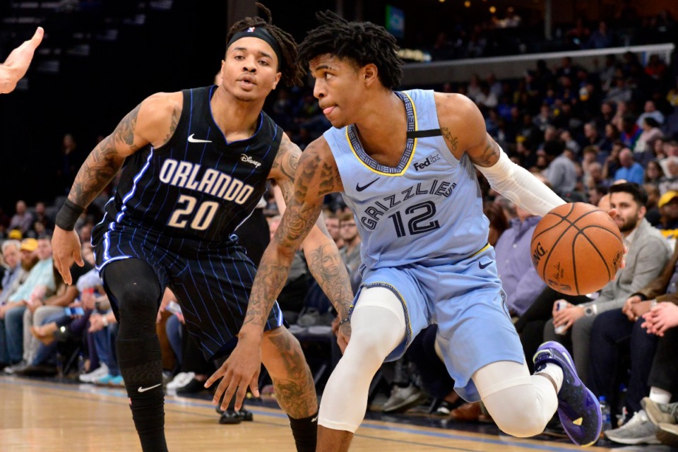 <strong>Memphis Grizzlies guard Ja Morant (12) drives past Orlando Magic guard Markelle Fultz (20)</strong>&nbsp;<strong>on March 10, 2020, at FedExForum.</strong> (Brandon Dill/AP)