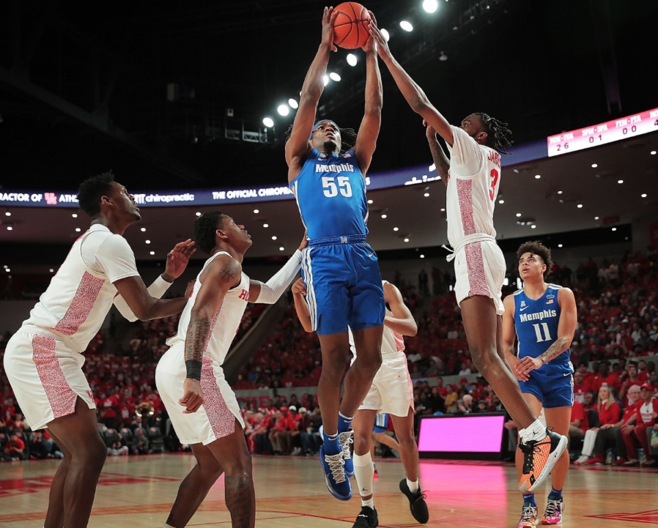 <strong>University of Memphis forward Precious Achiuwa (55) shoots under pressure by Houston's DeJon Jarreau (3) during the Tigers' game against the Cougars at the Fertitta Center in Houston on March 8, 2020.</strong> (Jim Weber/Daily Memphian)