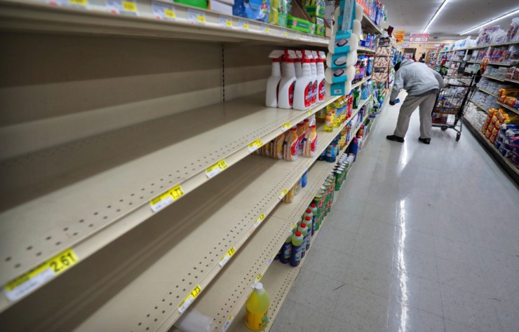 <strong>Shoppers look for cleaning supplies during a busy day at the CashSaver in Midtown on Thursday, March 12. Store manager Taylor James said there were shortages on cleaning wipes and disinfectant as customers fearful of COVID-19 stocked up on supplies.</strong> (Jim Weber/Daily Memphian)