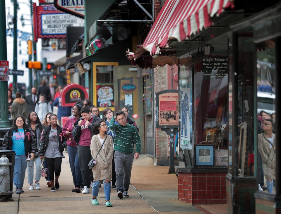 <strong>A smattering of tourists and spring breakers visit Beale Street on March 13, 2020, before the Centers for Disease Control and Prevention began urging a nationwide halt to gatherings of more than 50 people for the next eight weeks.</strong> (Jim Weber/Daily Memphian)