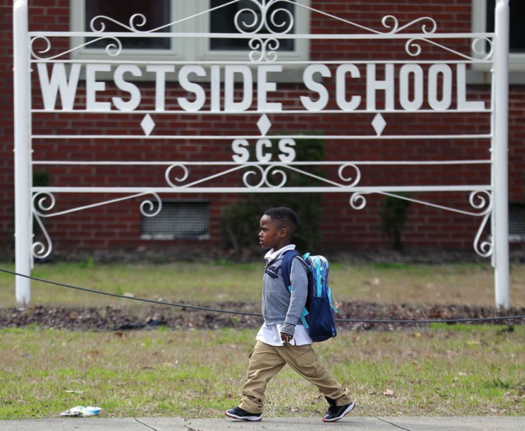 <strong>A Westside Elementary student walks past the front of his school after getting out of class on March 12, 2020.&nbsp;Shelby County Schools announced they are closing schools, starting March 13 and resuming March 30 &ldquo;due to national developments and rapidly changing conditions regarding the spread of COVID-19," said Shelby County Schools Superintendent Joris Ray.&nbsp;</strong> (Patrick Lantrip/Daily Memphian)