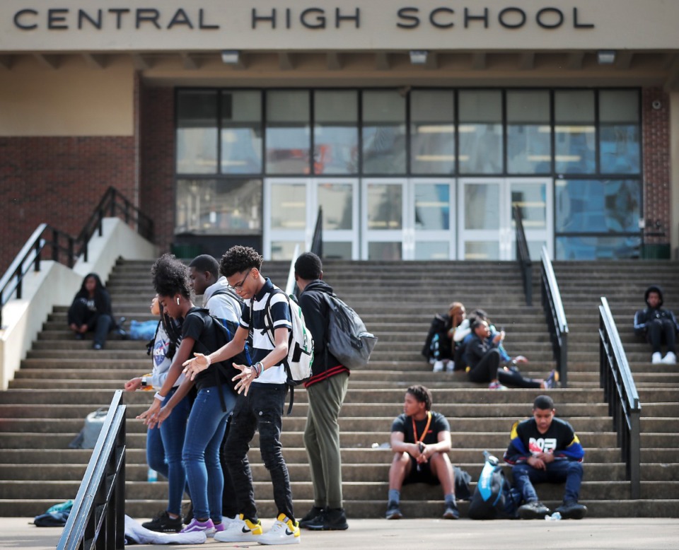 <strong>Central High School students listen to music as they wait for their afternoon ride on the steps at Central on March 12, 2020. Shelby County Schools announced they are closing schools, starting March 13 and resuming March 30 &ldquo;due to national developments and rapidly changing conditions regarding the spread of COVID-19," said Shelby County Schools Superintendent Joris Ray.</strong> (Jim Weber/Daily Memphian)