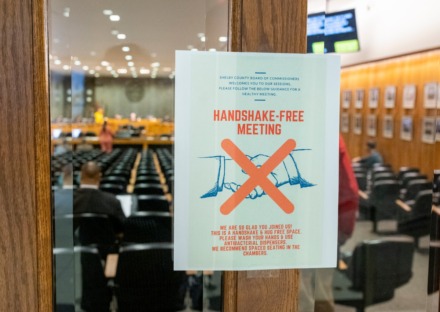 <strong>A notice was posted at the door for a handshake-free Shelby County Commission meeting on March 18, 2020.</strong> (Greg Campbell/Special to The Daily Memphian).