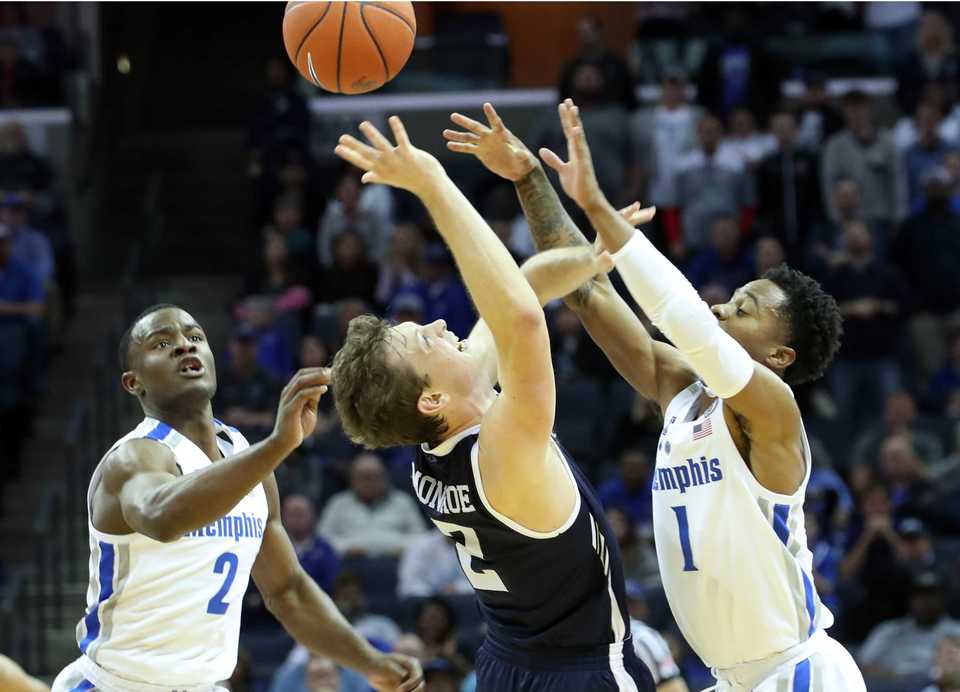 <strong>University of Memphis guards Alex Lomax (2) and Tyler Harris (1) battle Yale's Eric Monroe for a rebound&nbsp;</strong><span class="s1"><strong>during the Nov. 17 game at FedExForum in Memphis.</strong>&nbsp;(Karen Pulfer Focht/Special to The Daily Memphian)</span>