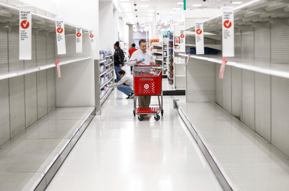 <strong>Customers shop the empty paper goods aisle at the Target Memphis Central Store on Wednesday, March 18, 2020.</strong> (Mark Weber/Daily Memphian)