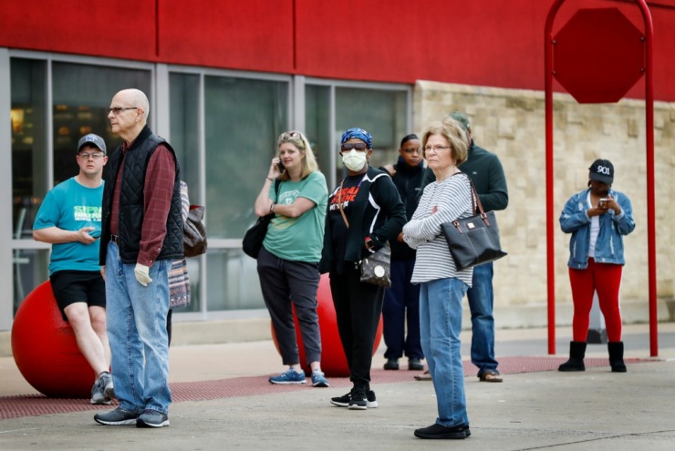 <strong>Target Memphis Central customers wait outside the store before it opens on Thursday, March 19, 2020. Since the outbreak of the coronavirus, the store replaces their cleaning supplies and paper good daily and by the afternoon they are gone.</strong> (Mark Weber/Daily Memphian)