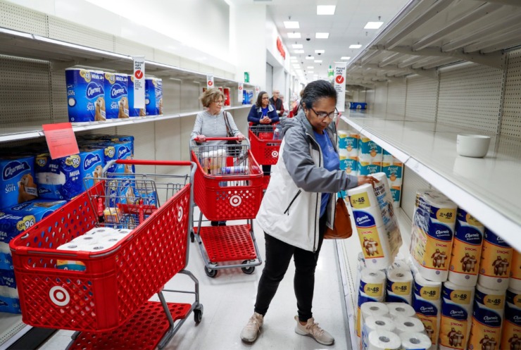 <strong>Target Memphis Central customers form a line as they grab toilet paper on Thursday, March 19, 2020. Since the outbreak of the coronavirus, the store replaces their cleaning supplies and paper good daily and by the afternoon they are gone.</strong> (Mark Weber/Daily Memphian)