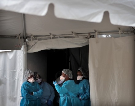 <strong>Nurses wait for the next drive-thru patient as staff from Christ Community Health Services administer some 50 free COVID-19 tests at a tent behind their South Memphis clinic on March 21, 2020. </strong>(Jim Weber/Daily Memphian)