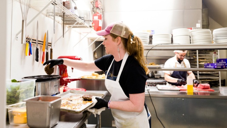 <strong>Kathleen Barth and Jose Upegui prepare orders in the Caritas kitchen in Midtown on March 23, 2020.</strong> (Ziggy Tucker/Daily Memphian)