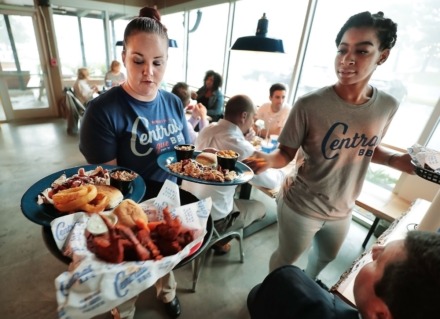 <strong>Lisa Carson (left) and Dearra Thompson serve Central BBQ favorites at the East Memphis Central BBQ. </strong>(Daily Memphian file)