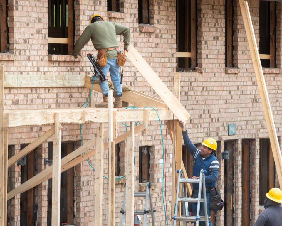 <strong>Construction workers continue to work on major renovations of the old Pleasant View Apartments in Frasyer Wednesday, March 25, 2020.</strong> (Greg Campbell/Special to The Daily Memphian)
