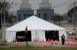 <strong>Staff and students from the University of Tennessee Health Science Center work with the Shelby County Health Department on March 25, 2020, to continue drive-thru testing for COVID-19 at the Memphis Fairgrounds.</strong> (Jim Weber/Daily Memphian)
