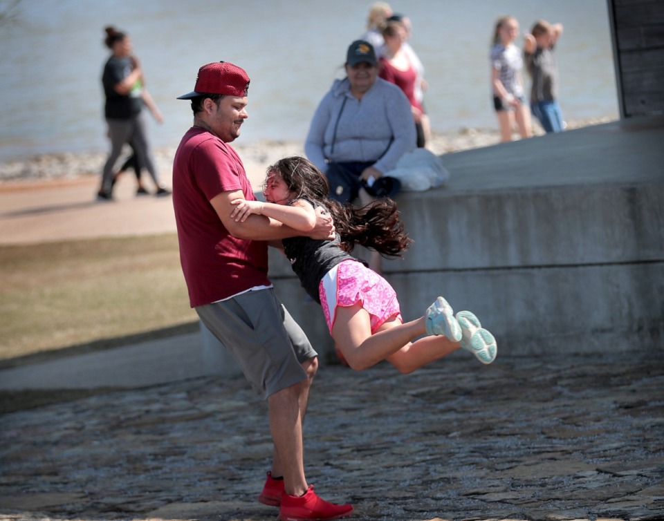 <strong>Erik Cortes spins his niece Anabella Garcia, 8, like a dervish at Shelby Farms on March 26, 2020, as Memphians emerge from their sheltering-in-place to enjoy a budding spring day after weeks of poor weather and worse news have conspired to keep most folks indoors.</strong> (Jim Weber/Daily Memphian)