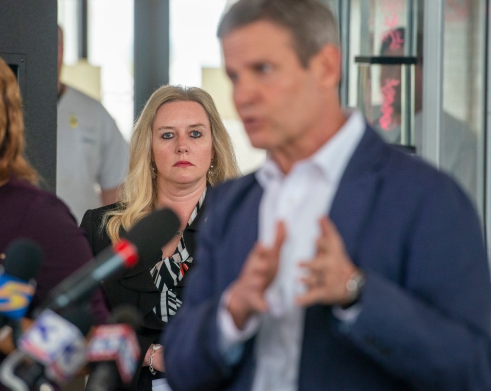 <strong>Dr. Lisa Piercey, Commissioner of the Tennessee Department of Health, listens to Gov. Bill Lee updates the press on COVID-19 numbers at the Memphis International Airport on March 27, 2020.</strong> (Greg Campbell/Special to The Daily Memphian)