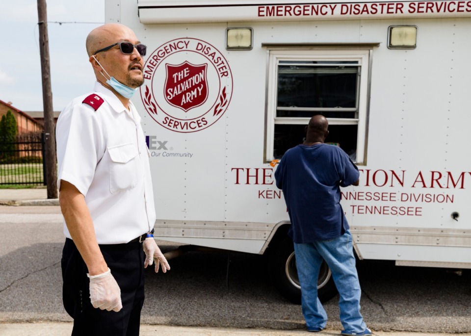 <strong>Lt. Hoon Chung of the Salvation Army helps distribute food outside the Memphis Union Mission on Friday, March 27.&nbsp;An anonymous donor gave money to the Salvation Army to buy meals from local restaurants to deliver to the homeless, and one of the restaurants they called was Garibaldi&rsquo;s.</strong> (Ziggy Mack/Special to the Daily Memphian)