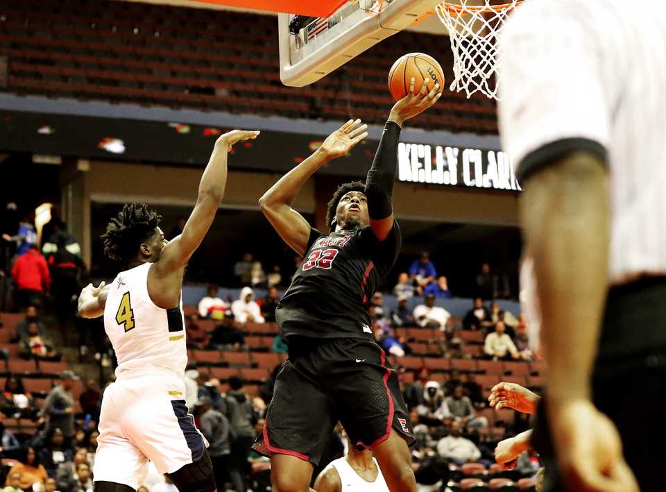 <strong>East High School center James Wiseman (32) pulls up for a one-handed jumpshot in a game against Olive Branch High at the Landers Center on Tuesday, Nov. 20, 2018. Earlier in the day, Wiseman committed to Penny Hardaway's 2019 recruiting class at the University of Memphis.</strong> (Houston Cofield/Daily Memphian)