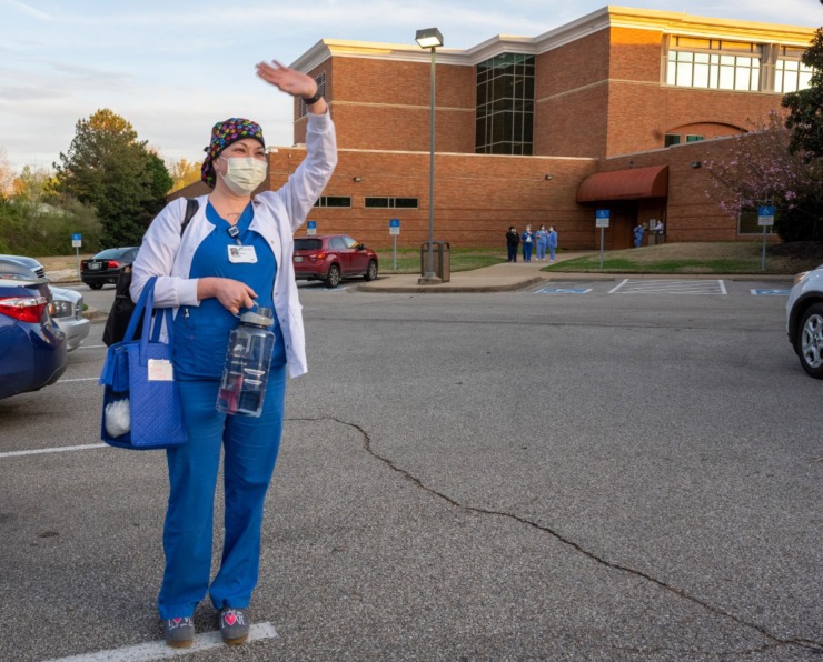 <strong>Trisha Gray, R.N. waves at the supporters gathered at Baptist Memorial Hospital-Collierville Sunday, March 29, 2020. A group showed up Sunday at shift change to express their appreciation to the health care workers.</strong> (Greg Campbell/Special to The Daily Memphian)