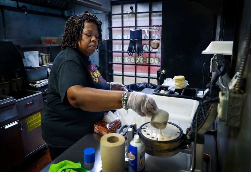 <strong>Waffle Mania co-owner Tarliscia Rainey, a Pre-K teacher at Egypt Elementary School, makes waffles on Monday, March 30, 2020. The restaurant will giving away free breakfast to 100 students each day during March 30-April 3.</strong> (Mark Weber/ The Daily Memphian)