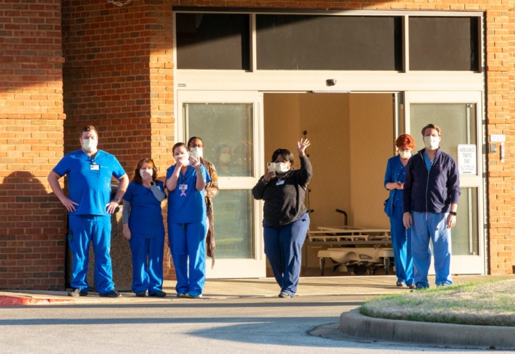 <strong>ER staff at Baptist Memorial Hospital-Collierville come out of the hospital to view the signs and supporters gathered to show their appreciation for the health care workers, Sunday, March 29, 2020.</strong> (Greg Campbell/Special for The Daily Memphian)