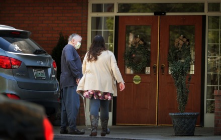 <strong>An elderly resident returns home with help from a relative on April 1, 2020, at the Carriage Court assisted living facility in East Memphis where five residents and an employee tested positive for COVID-19.</strong> (Jim Weber/Daily Memphian)