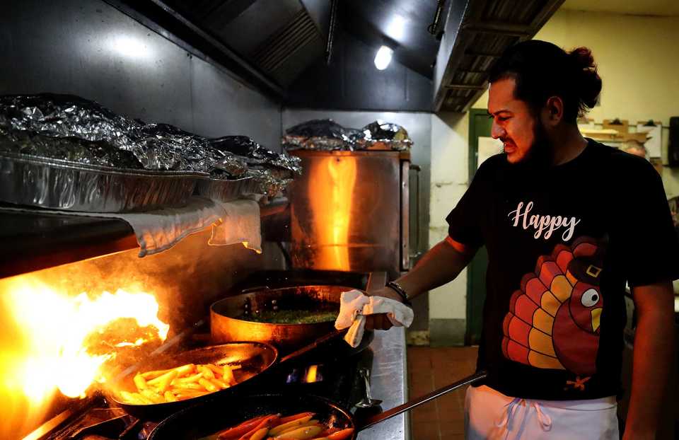 <strong>Chef Victor Williams cooks vegetables in Napa Cafe's kitchen for the restaurant's free Thanksgiving meal. For three years Napa Cafe has provided meals for those in need in honor of owner Glenda Hastings' late mother,&nbsp;<span>Donna Watts</span>.</strong> (Houston Cofield/Daily Memphian)