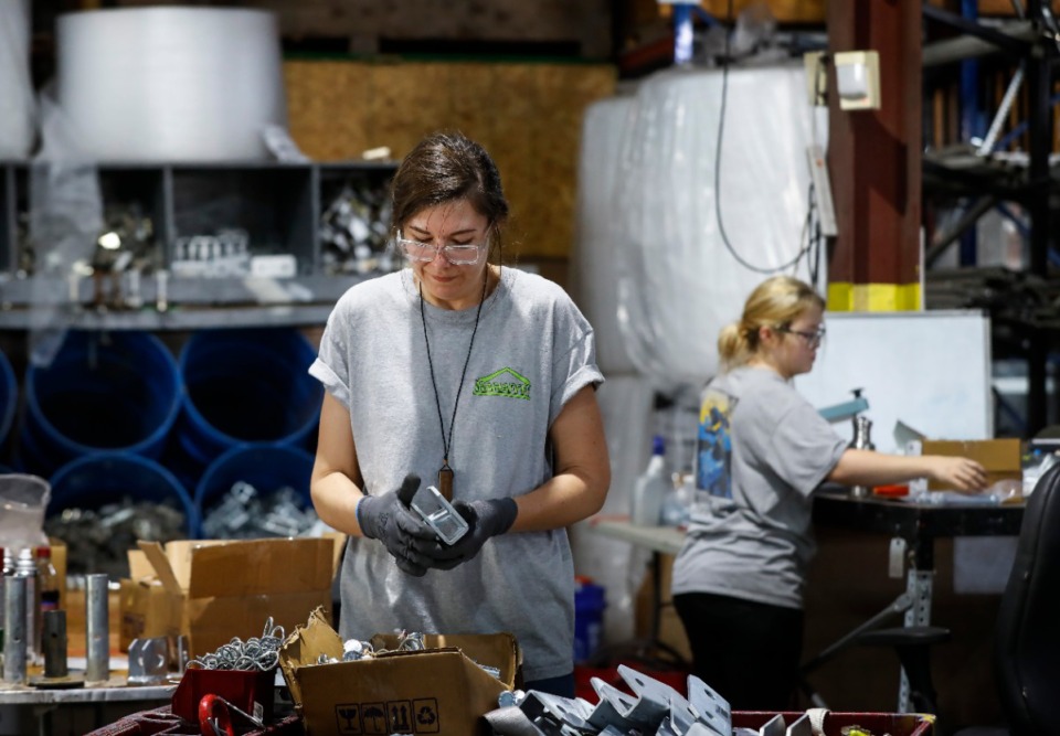 <strong>Mahaffey employee Nicole Sztapka (front) works on packing cable fasteners for shipping on Wednesday, April 8, 2020.</strong> (Mark Weber/Daily Memphian)