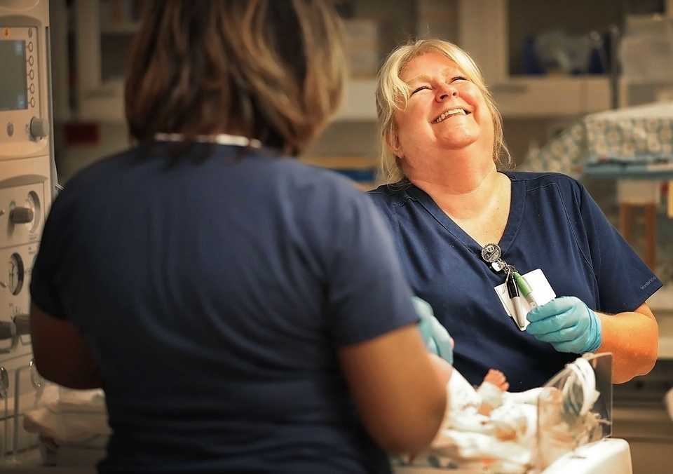 <strong>Nurse Rachelle Bishop talks with a colleague while treating a newly admitted infant in October at Regional One Health's neonatal intensive care unit.</strong> (Jim Weber/Daily Memphian)