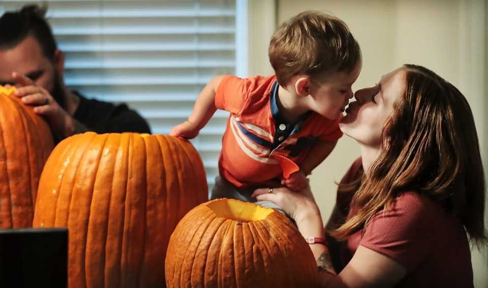 <strong>Amanda Bass carves pumpkins with her 1-year-old son Owen and the rest of their family at their Collierville home in November Amanda had a high-risk pregnancy at Regional One because of chronic health conditions and delivered her son at 28 weeks.</strong> (Jim Weber/Daily Memphian)