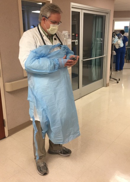 <strong>Dr. Stephen Threlkeld, co-director of Baptist Memorial Hospital-Memphis&rsquo; infectious disease program, checks his messages before visiting the hospital&rsquo;s COVID ICU unit.</strong> (Chris Herrington/Daily Memphian)