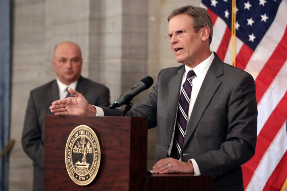 <strong>Tennessee Gov. Bill Lee, seen here at right on March 16 in Nashville, has extended the 'stay at home' order until April 30.</strong> (Mark Humphrey/AP)