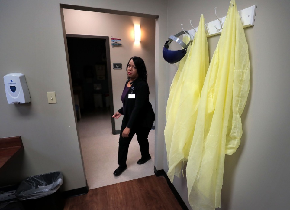 <strong>Regional Operations Manager Cassandra Mitchell passes by personal protective equipment at the Cherokee Healthcare clinic in Frayser on April, 14, 2020.&nbsp;</strong>(Jim Weber/Daily Memphian)