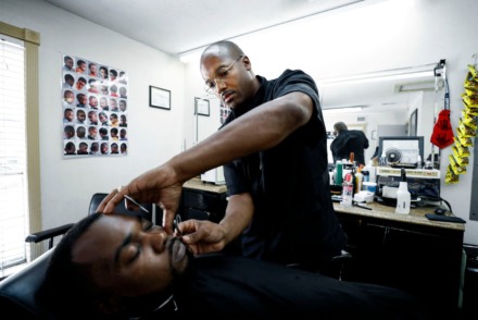 <strong>Barber Carnell Vann Jr. touches up customer Jessie Marshall Jr.&rsquo;s edges while giving him a haircut on July 9, 2019. Vann received a $20,000 Inner City Economic Development loan to open a his own barbershop in the Frayser area.</strong> (Mark Weber/Daily Memphian file)