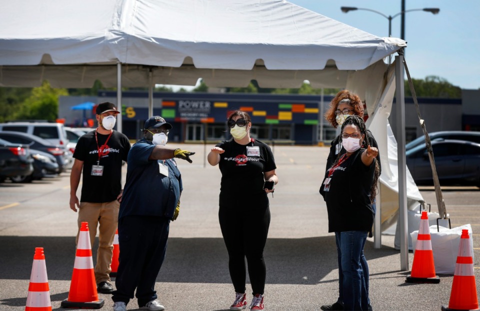 <strong>Christ Community Health Services staff members setup a drive-thru COVID-19 testing site on Friday, April 17, 2020 in the Mendenhall Square Shopping Center. The number of tests administered in Shelby County is 19,195.</strong> (Mark Weber/Daily Memphian)