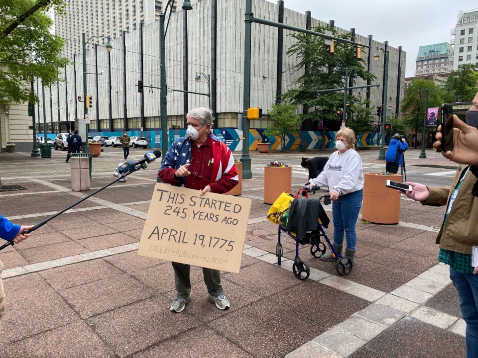 <strong>Hal Rounds (holding sign) led a protest Sunday, April 19 outside City Hall in Downtown Memphis.</strong><span>&nbsp;(Bill Dries/Daily Memphian)</span>
