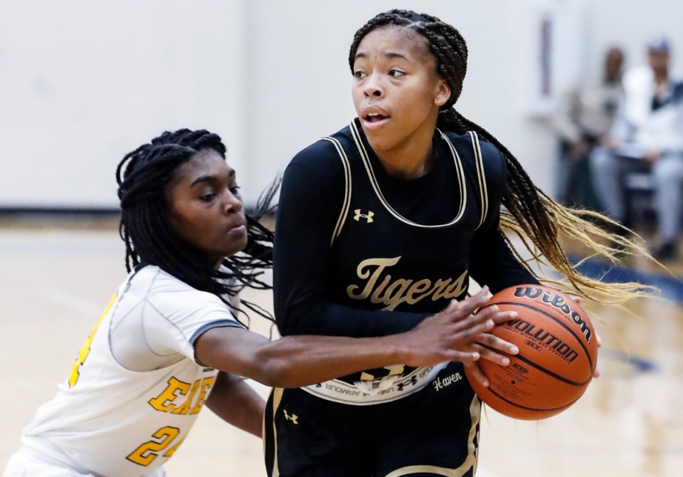 <strong>Whitehaven guard Se&rsquo;Quoia Allmond (right, driving the lane against Memphis Business Academy's A&rsquo;nyah Rucker on Jan. 2) has been selected to the Class AAA all-state basketball team.</strong> (Mark Weber/Daily Memphian file)
