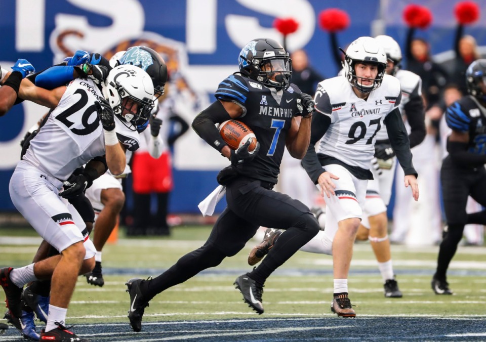 <strong>Memphis kick returner Chris Claybrooks (middle) scrambles for a touchdown against Cincinnati on Nov. 29, 2019, at the Liberty Bowl Memorial Stadium.&nbsp;Claybrooks is hoping his name is called this week in the 2020 NFL Draft.</strong> (Mark Weber/Daily Memphian file)