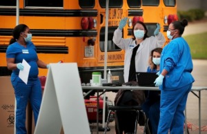 <strong>Nurses and medical technicians prescreen patients as staff from Cherokee Health and Kroger team up to offer a limited 3-day run of free drive-thru COVID-19 testing for people with symptoms, healthcare workers and first responders in the parking lot at the Memphis Business Academy in Frayser on April 22, 2020.</strong> (Jim Weber/Daily Memphian)