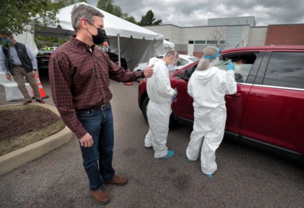 <strong>Tennessee Governor Bill Lee thanks Memphians sitting in line to be tested for COVID-19 by National Guard Medics during a visit to the Christ Community testing site in Frayser on April 25, 2020.</strong> (Jim Weber/Daily Memphian file)