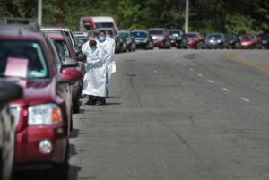 <strong>Christ Community medical technicians, nurses and National Guard medics collect information from hundreds of Memphians who want to be tested for COVID-19 at the Christ Community testing site in Frayser on April 25, 2020.</strong> (Jim Weber/Daily Memphian)